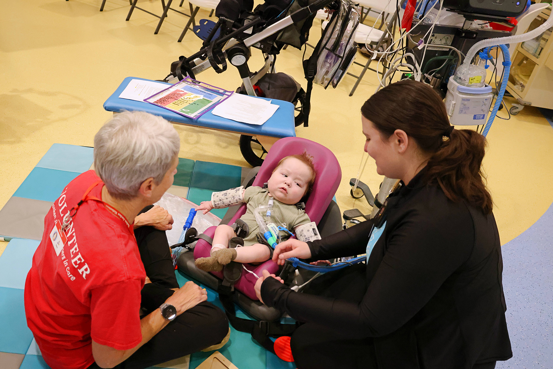 Female therapist with a female Ranken Jordan patient during an outpatient camp session