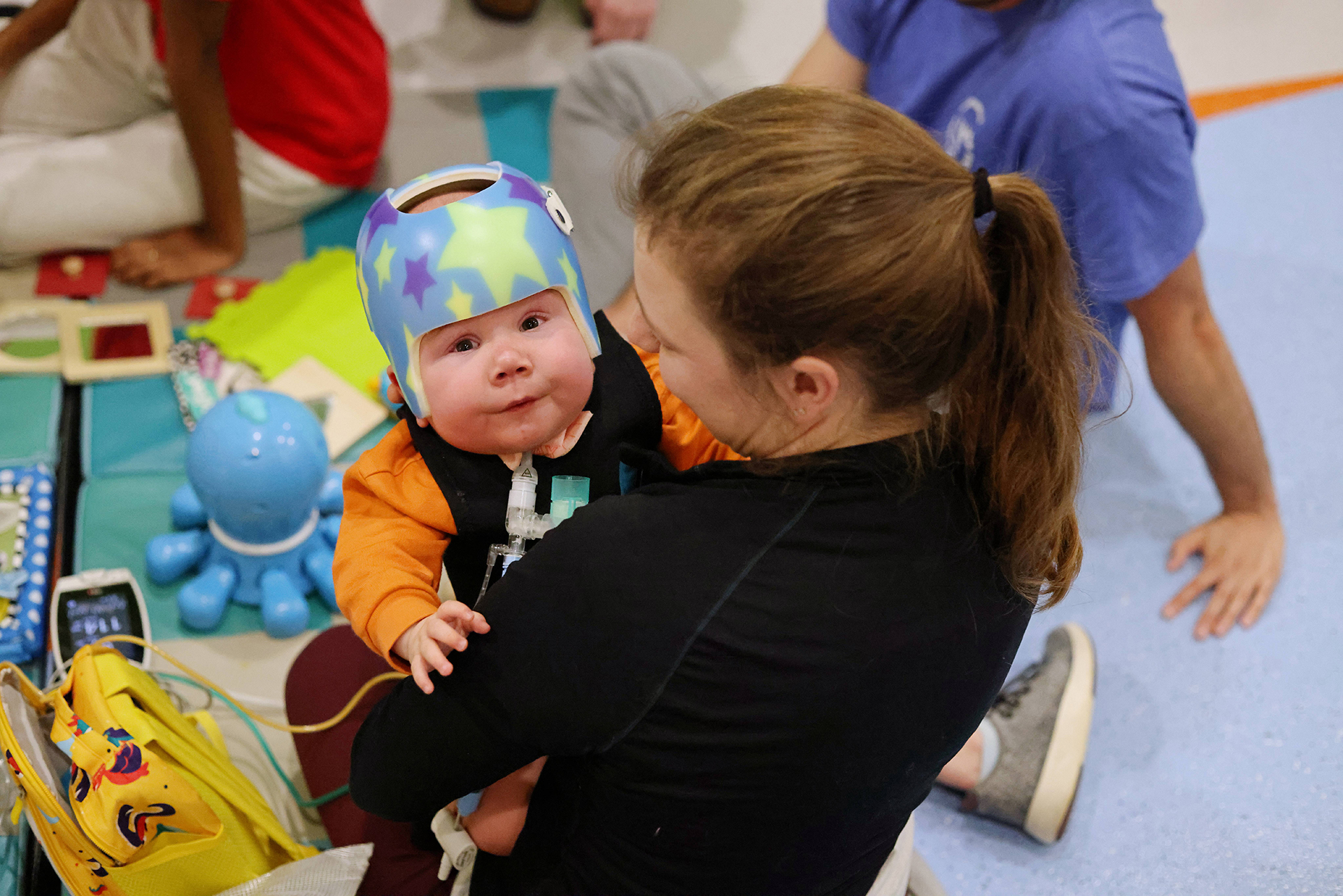 Female therapist with a female Ranken Jordan patient during an outpatient camp session